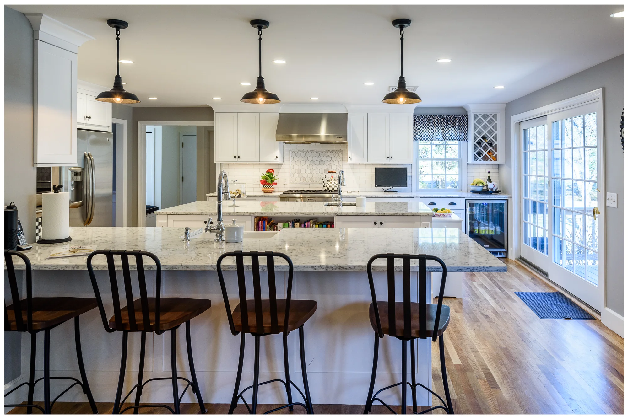 Transitional white kitchen with large island, Wayland