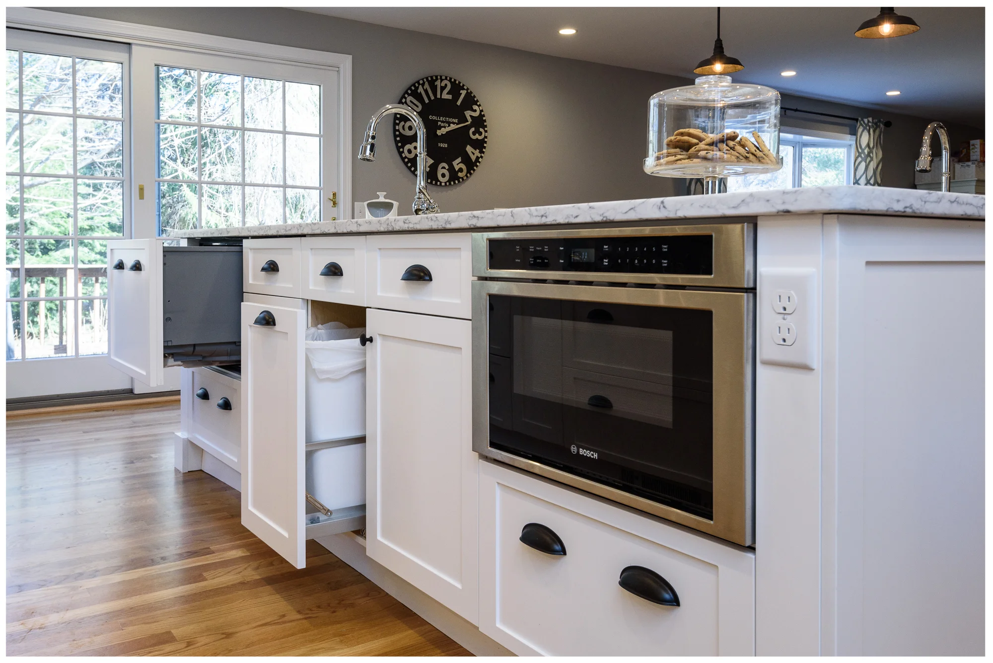 Detail of island cabinetry with built-in microwave drawer